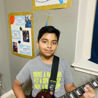 A random kid with 8 years of experience of guitar willing to teach anyone of any age. I can teach music theory, songs, scales, etc!